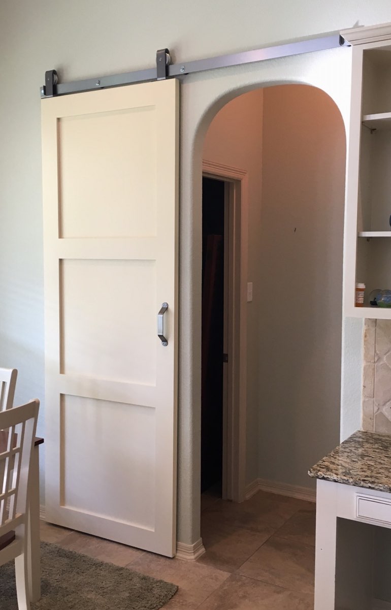 Contemporary style barn door in Denver kitchen.